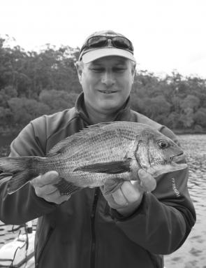 Macka with a stud black bream well over a kilo from one of the far southern estuaries.